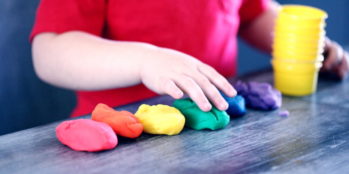 child playing with dough 